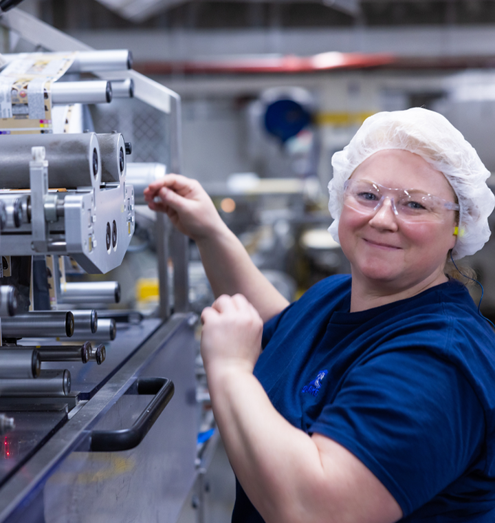 Woman working on machinery