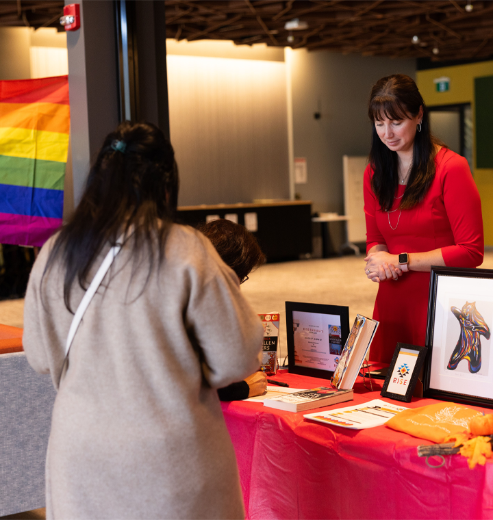 Employee at an employee resource group information booth