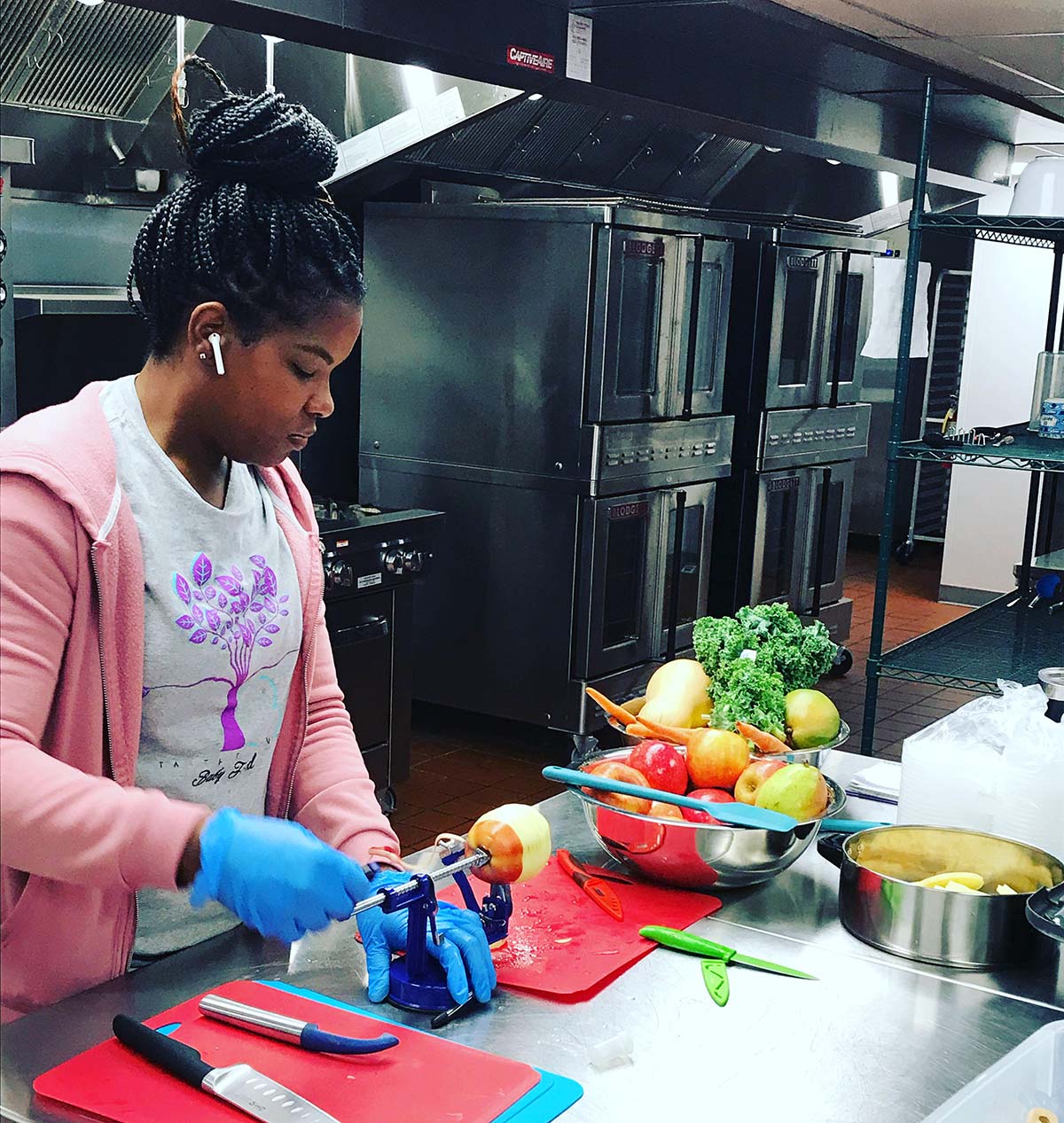 Woman preparing food in the kitchen at Taste-T-Love