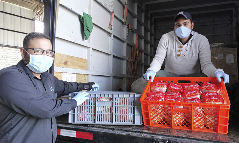 Food for Good workers on a delivery